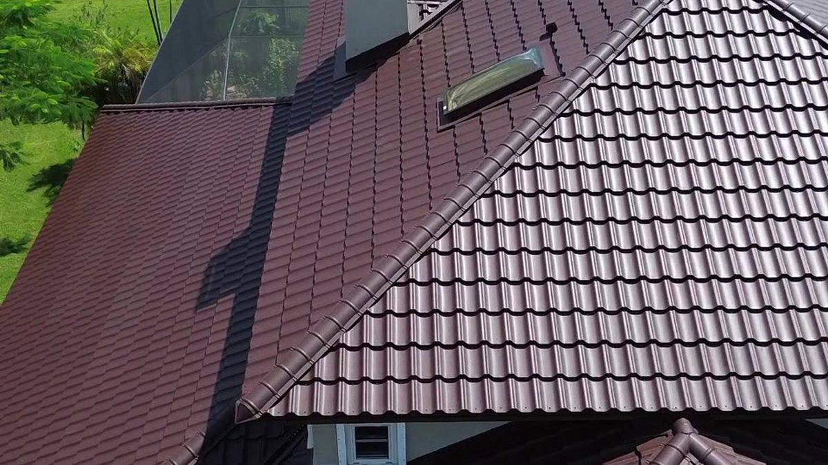 Worthouse steel tile roof in burgundy on a canal home — Horizon Roofing Florida
