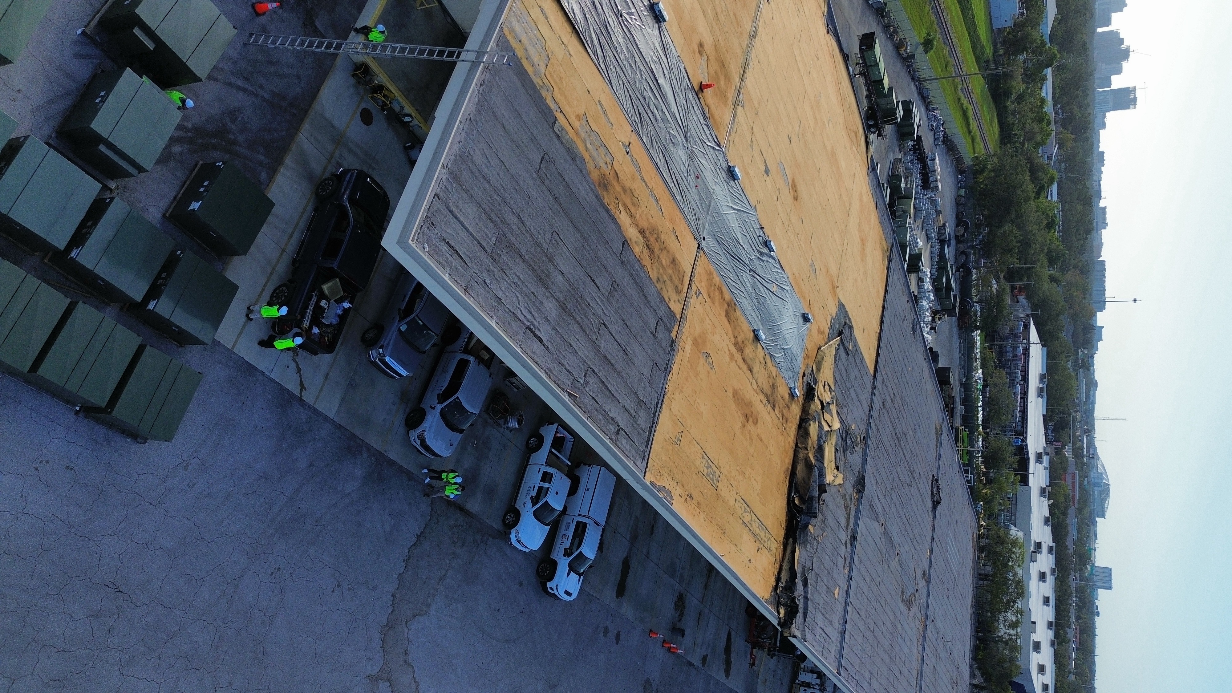 Duke Energy St. Petersburg facility after Hurricane Milton — tornado damage to modified bitumen BUR roof, Horizon emergency dry-in, later replaced with TPO