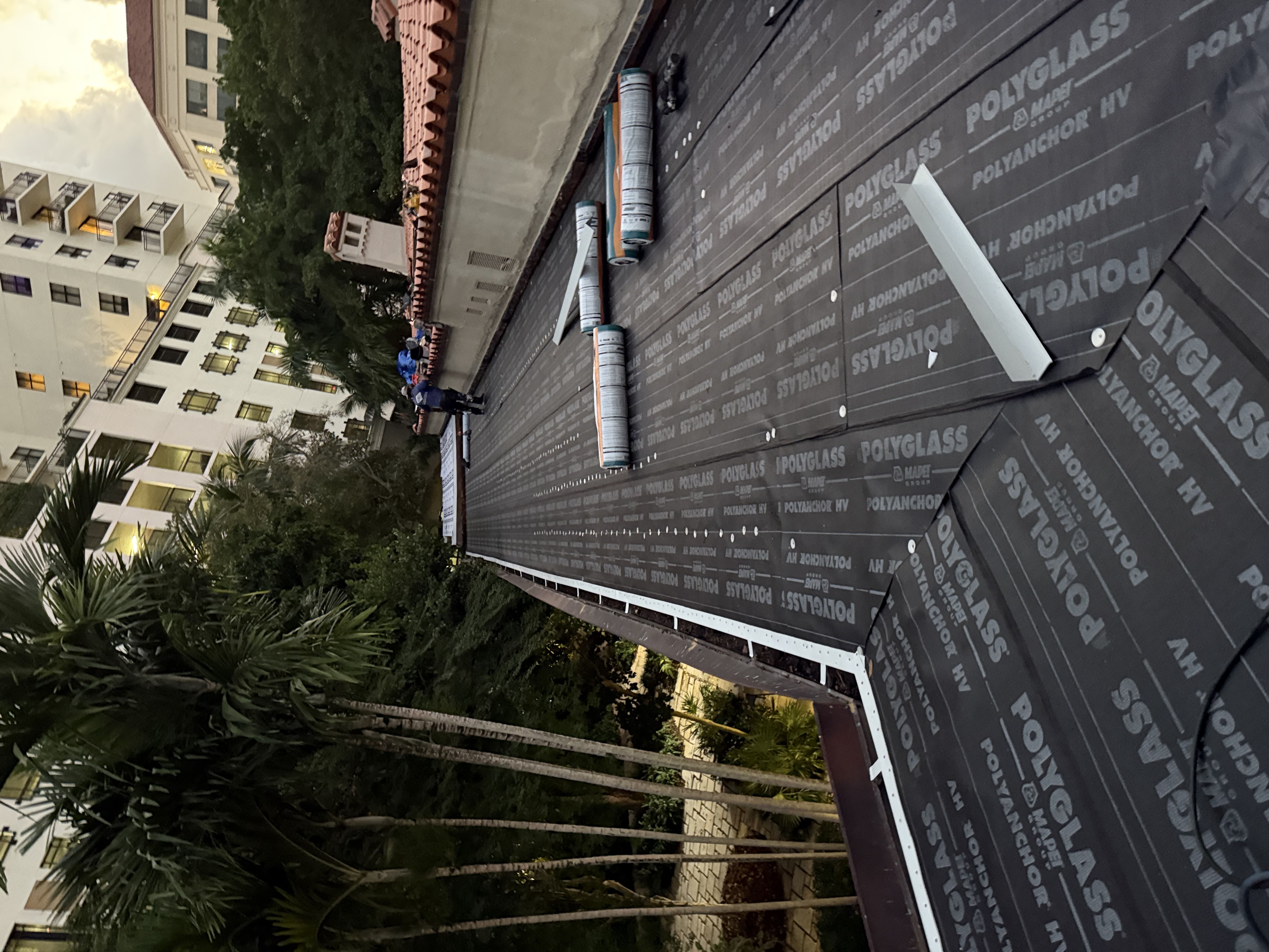 Polyglass PolyAnchor HV flat roof install with technician coastal SWFL