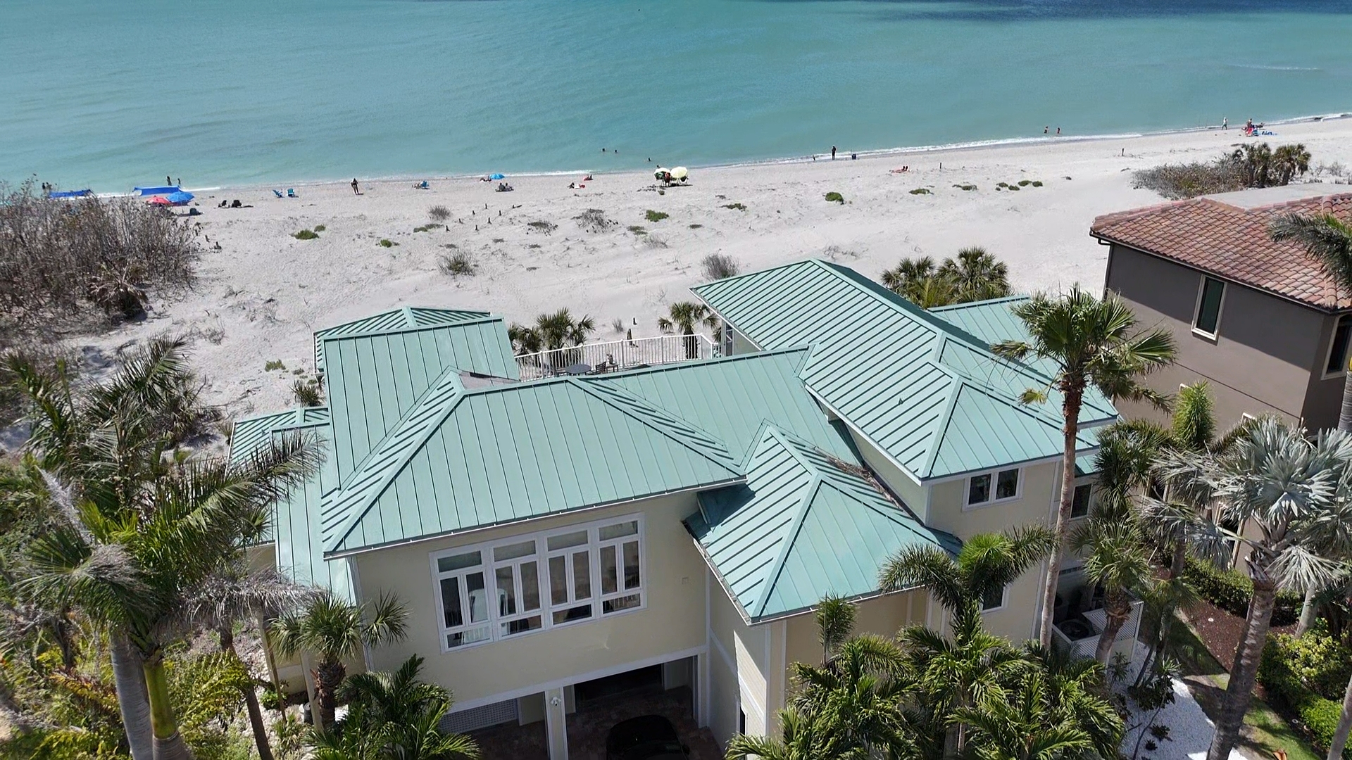 Seafoam standing seam metal roof beachfront SWFL home